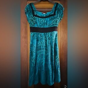Teal Patterned Dress with Ruched Bodice, Square Neckline, and Striking Trim